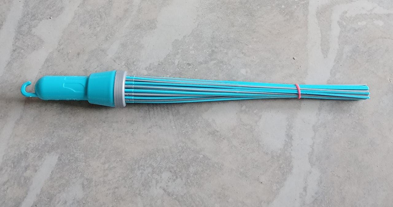 Plastic broom for effective cleaning, highlighting its stiff bristles and base.