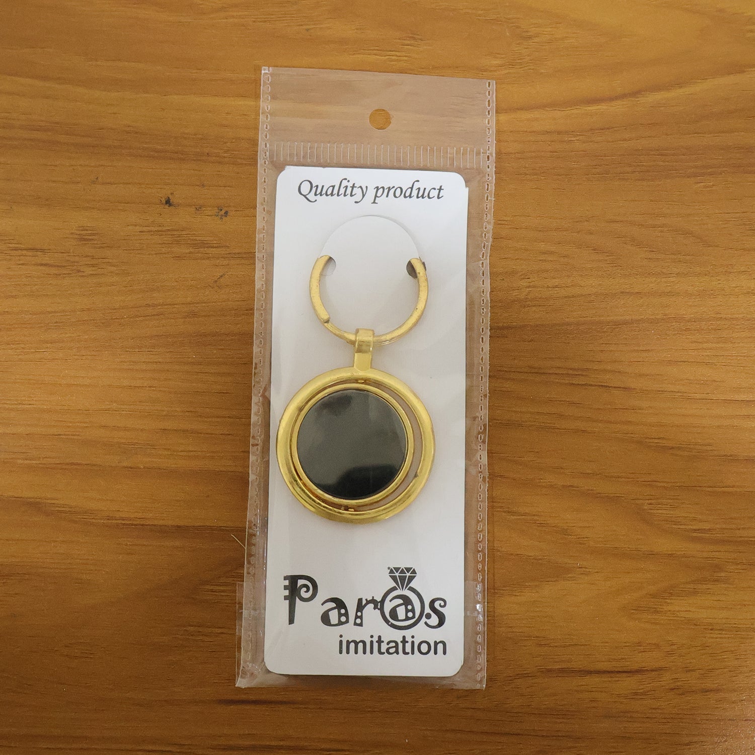 Elegant gold plated keychain with strong metal ring, perfect for keys and bags.
