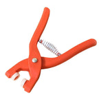 A pair of eyelet pliers used for installing grommets on clothing or accessories.