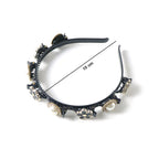Close-up of elegant pearl & floral hairband showing detailed design