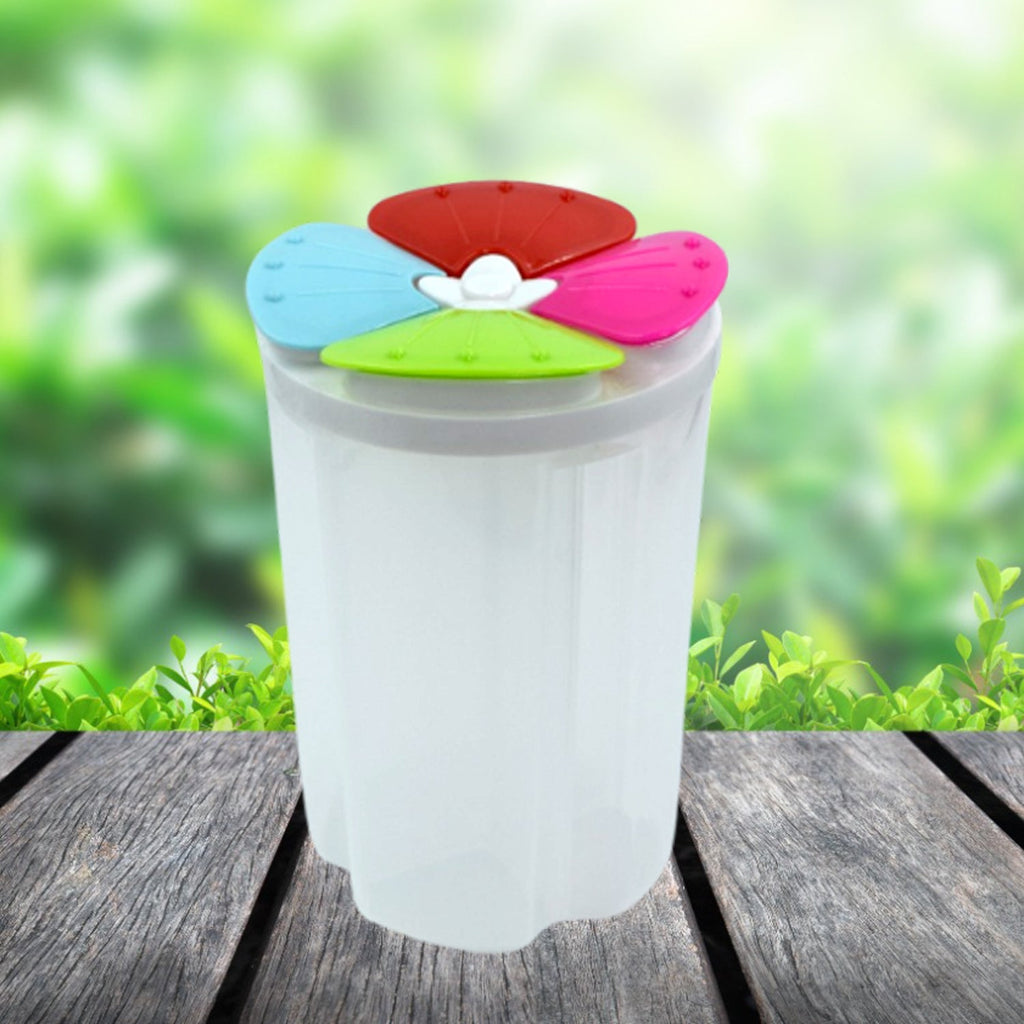 Side view of an empty airtight 4 section food storage container.