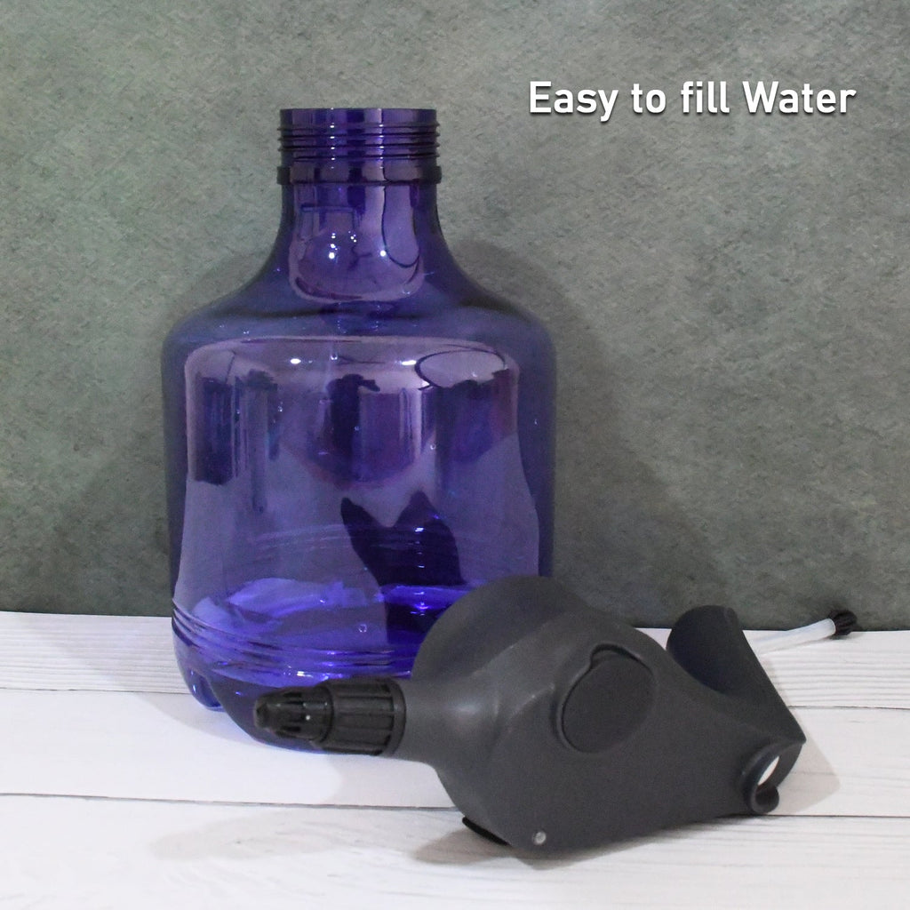 An electric garden sprayer gently misting a lush green plant for efficient and even watering.