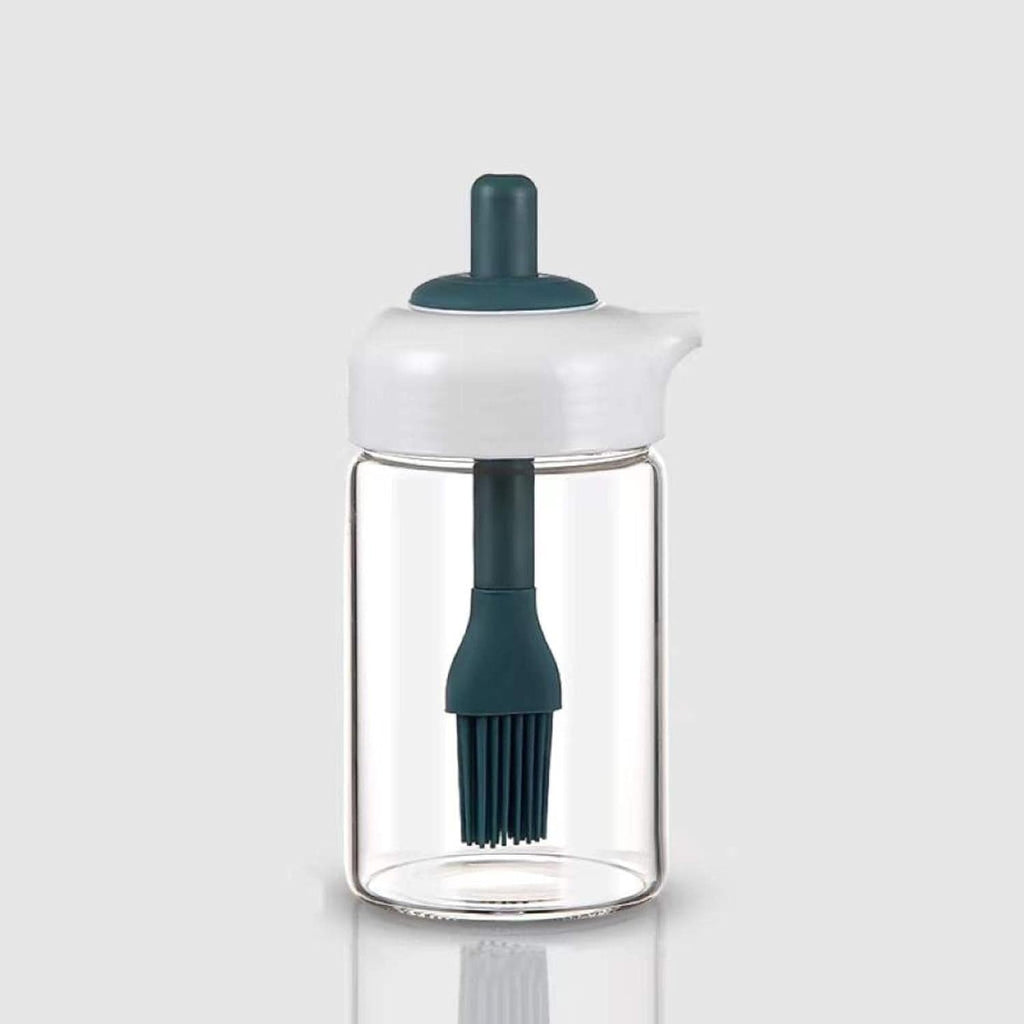 Glass oil dispenser with a brush, ideal for grilling, baking, or general cooking.