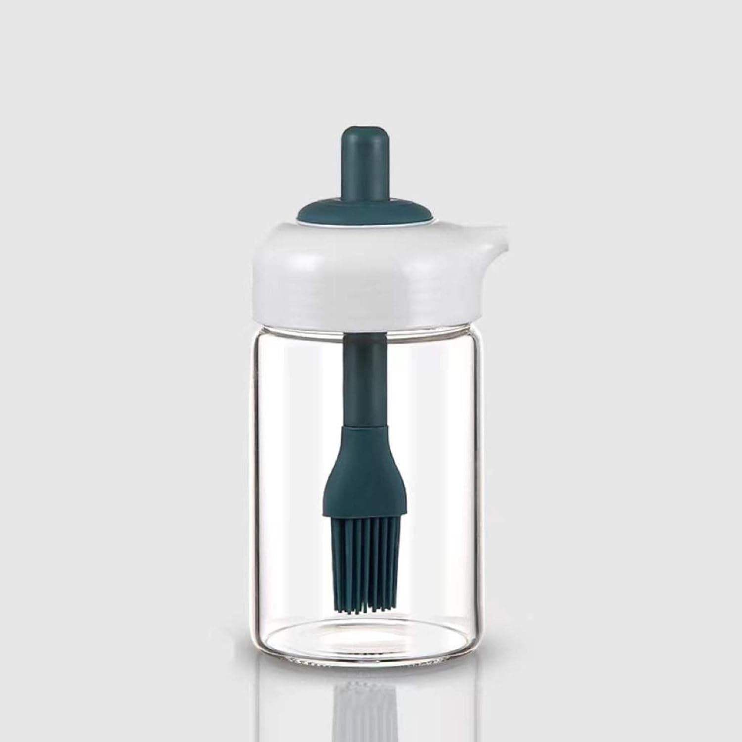 Glass oil dispenser with a brush, ideal for grilling, baking, or general cooking.