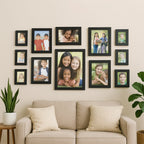 Wall-mounted black 12 photo frame set showcasing photos and certificates