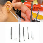 Detailed view of an individual stainless steel ear curette and a spiral ear cleaner.
