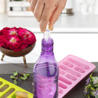 Close-up of ice trays stacked and ready to freeze