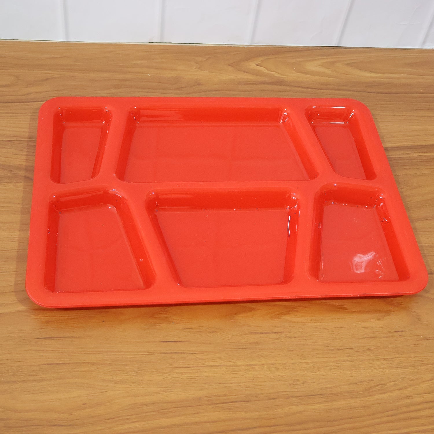Multi-section plastic serving tray with smooth surface for quick washing