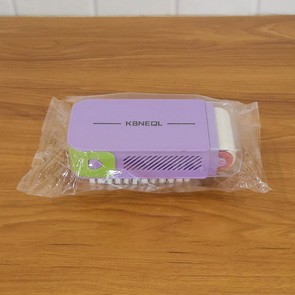 Ergonomic handheld cleaning brush with integrated roller scrubber