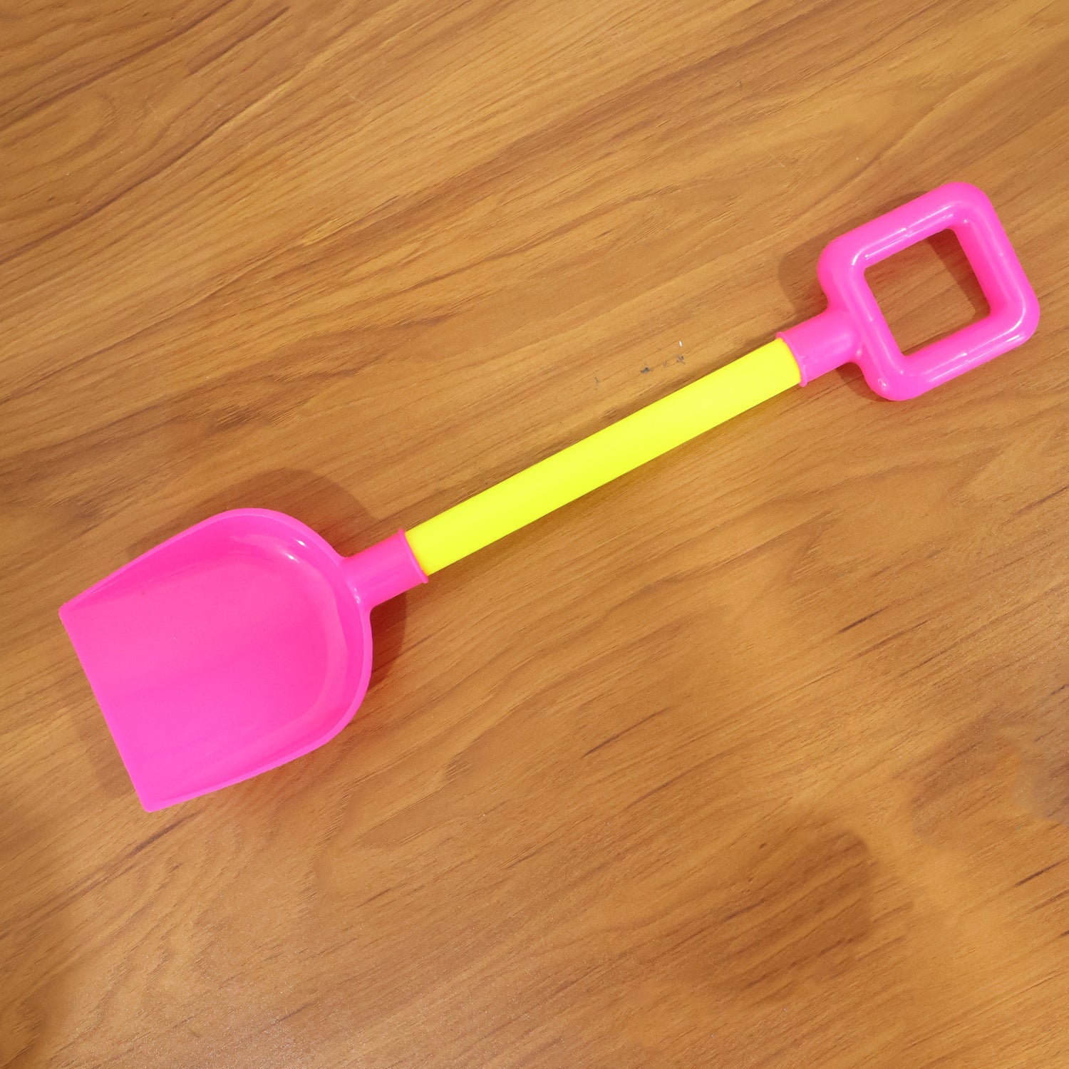 Set of colorful kids beach shovels and spades for sand play