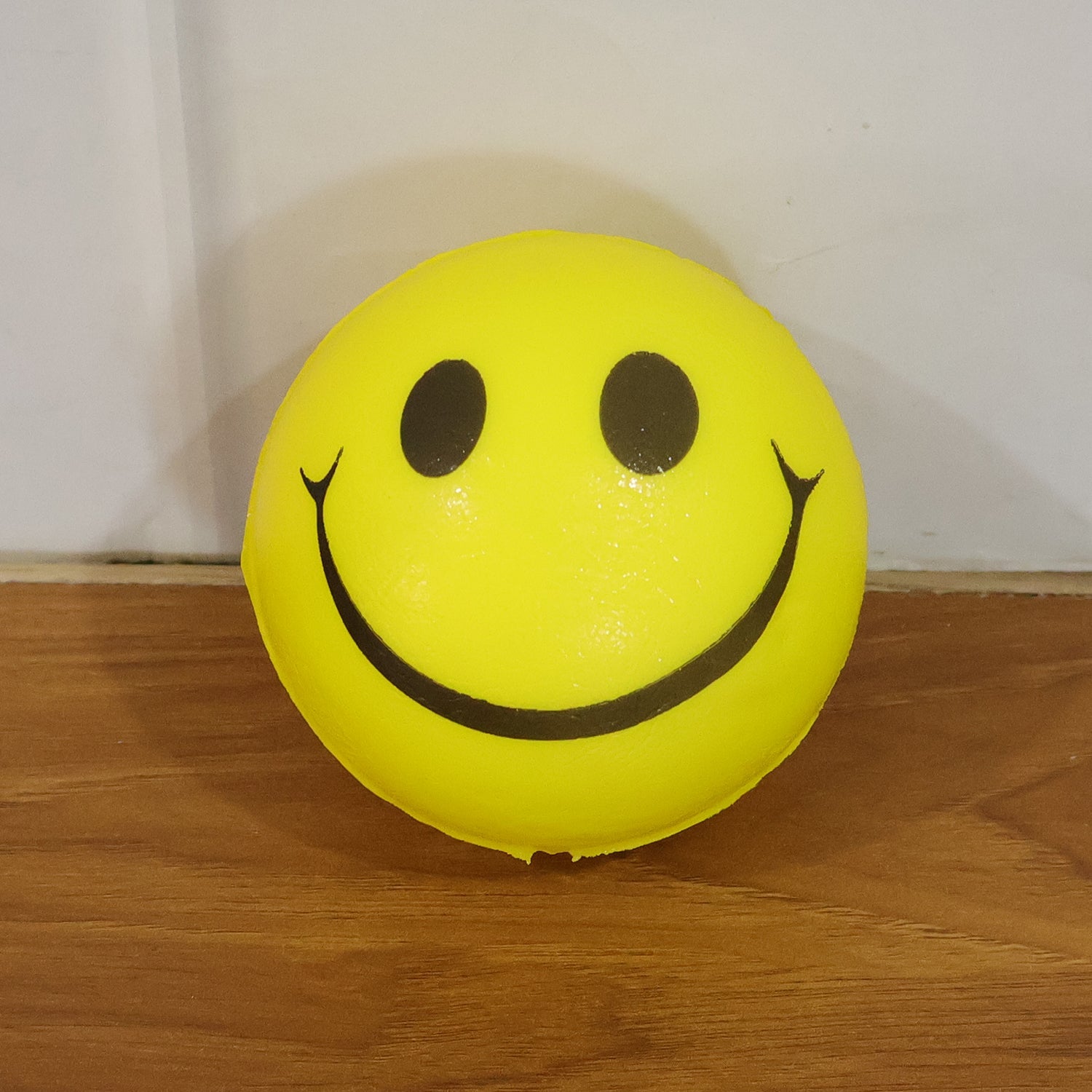 Cute smiley face foam stress ball for relaxation and therapy