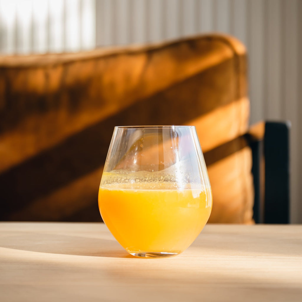 Pilsner glass filled with a refreshing beverage, ready for serving.