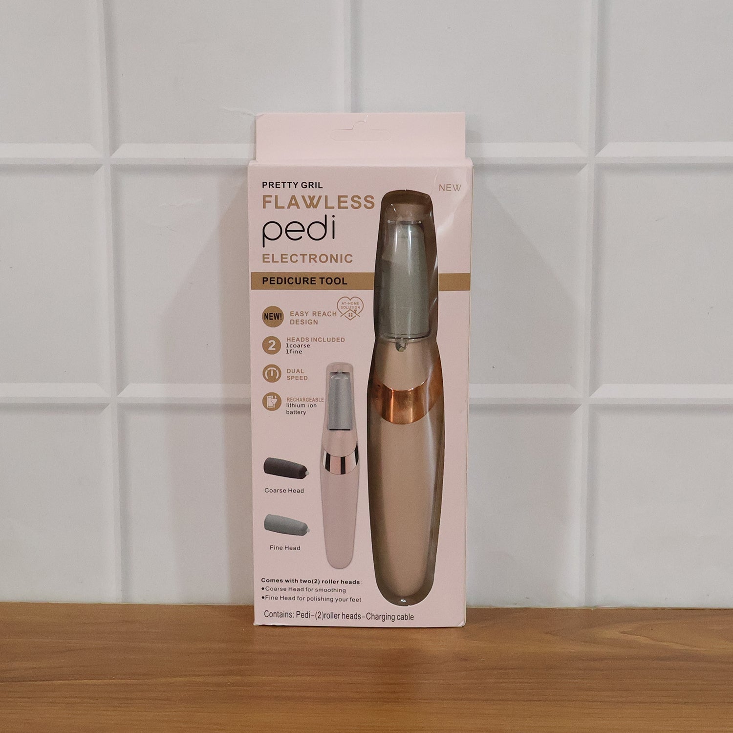 Close-up of the powerful electronic pedicure tool, emphasizing the dual roller heads.