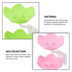 Flower-shaped self-draining soap dish displayed on a countertop next to a sink.