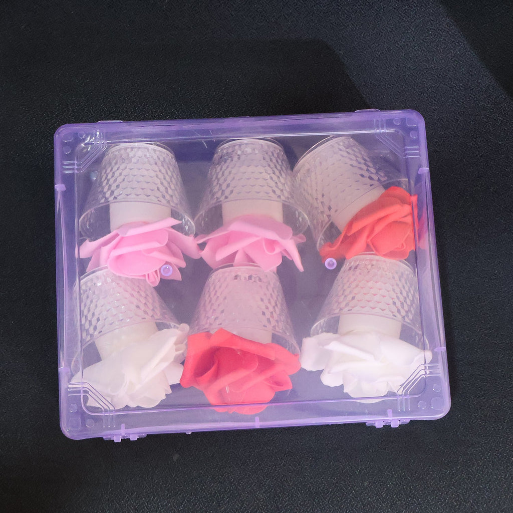 Close-up of LED rose flower decorative candle in flickering mode