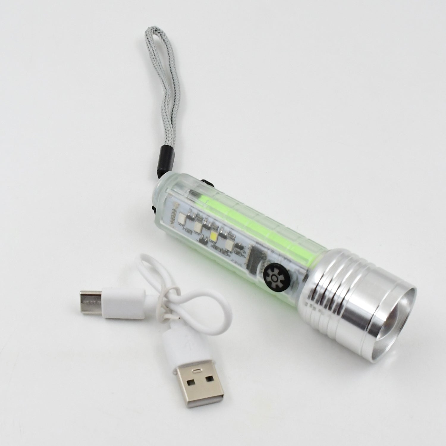 Portable mini flashlight held in hand, highlighting its compact size.