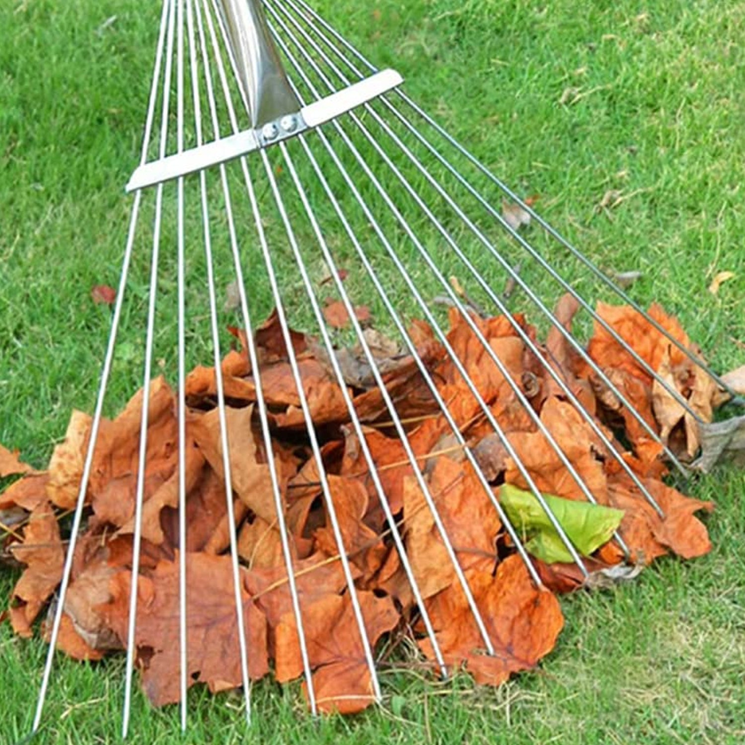 Side view of the adjustable garden rake showcasing its ergonomic long handle design.