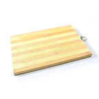 Wooden chopping board with fresh sliced vegetables.