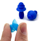 Close-up of an XcelSafe foam ear plug, highlighting its soft, pliable texture and ergonomic shape.