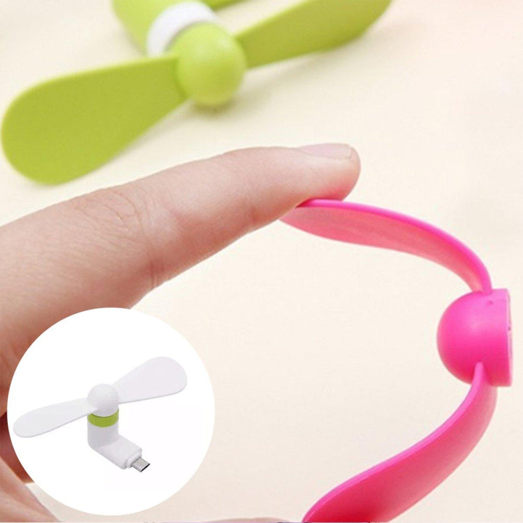 Mini USB fan connected to a power bank for cool air anytime.