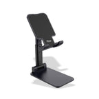 Person using the desktop tablet stand for hands-free video viewing.