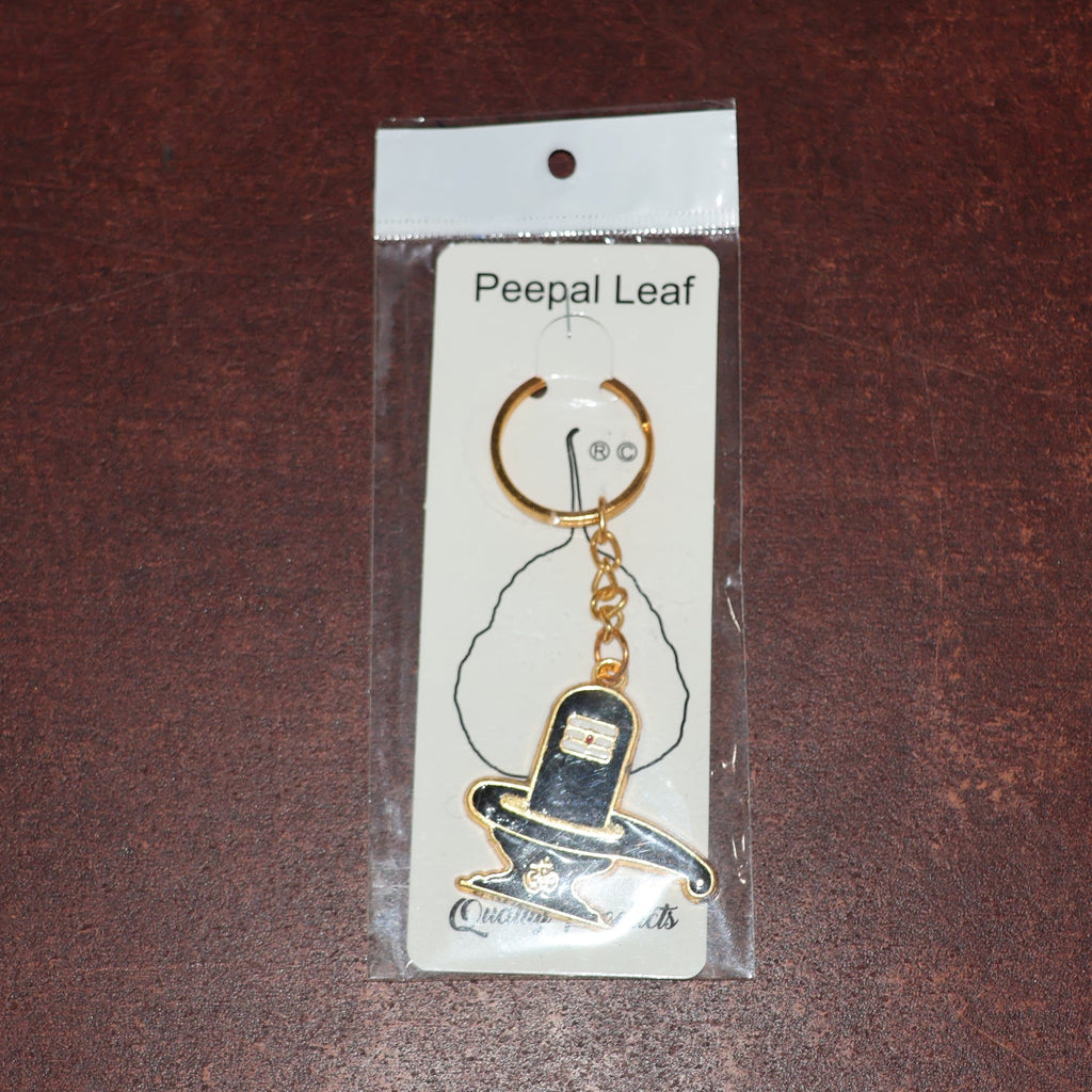 Packaging detail of golden Shivling keychain