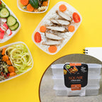 Three empty Konvex plastic square lunch boxes stacked neatly for space-saving storage.