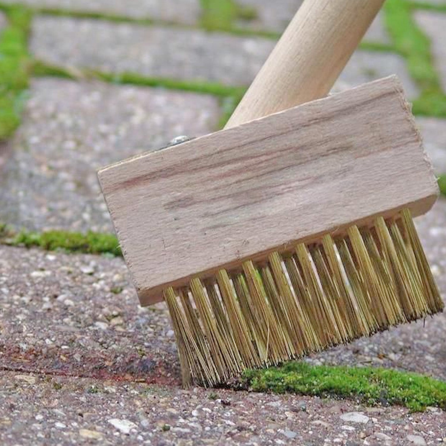 Ergonomic wooden handle of the patio weed remover tool for comfortable grip.