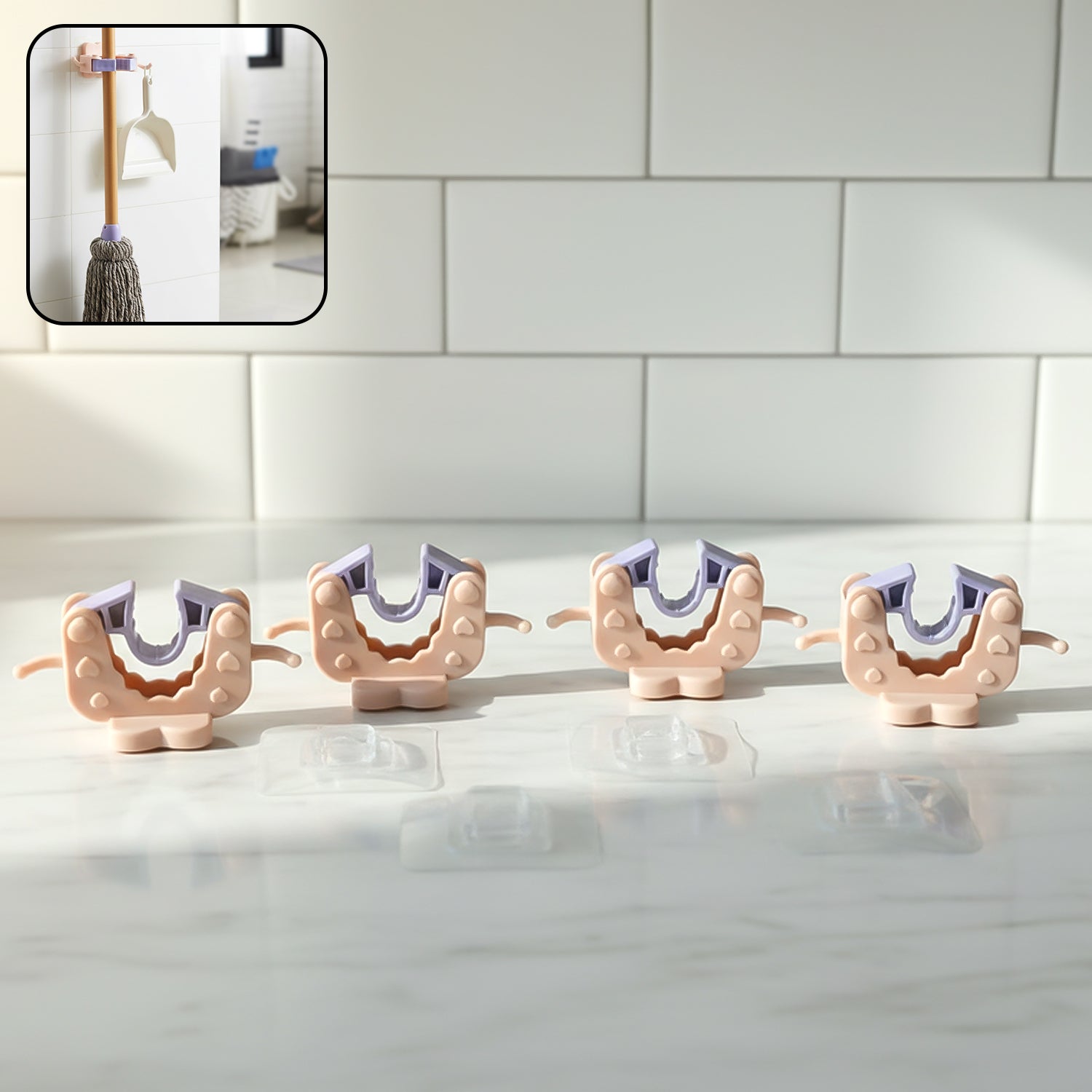 Close-up view of wall mounted broom and mop holder clip