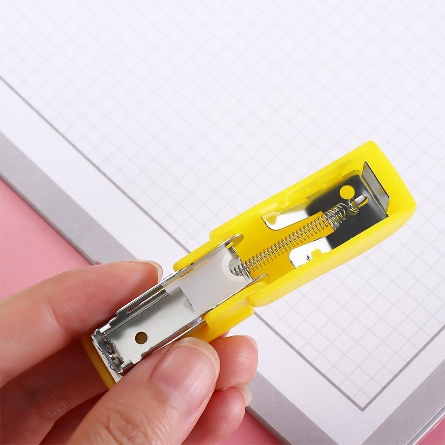 Closeup of compact colorful stapler with included staples