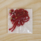 Detailed view of red rakhi beads and thread