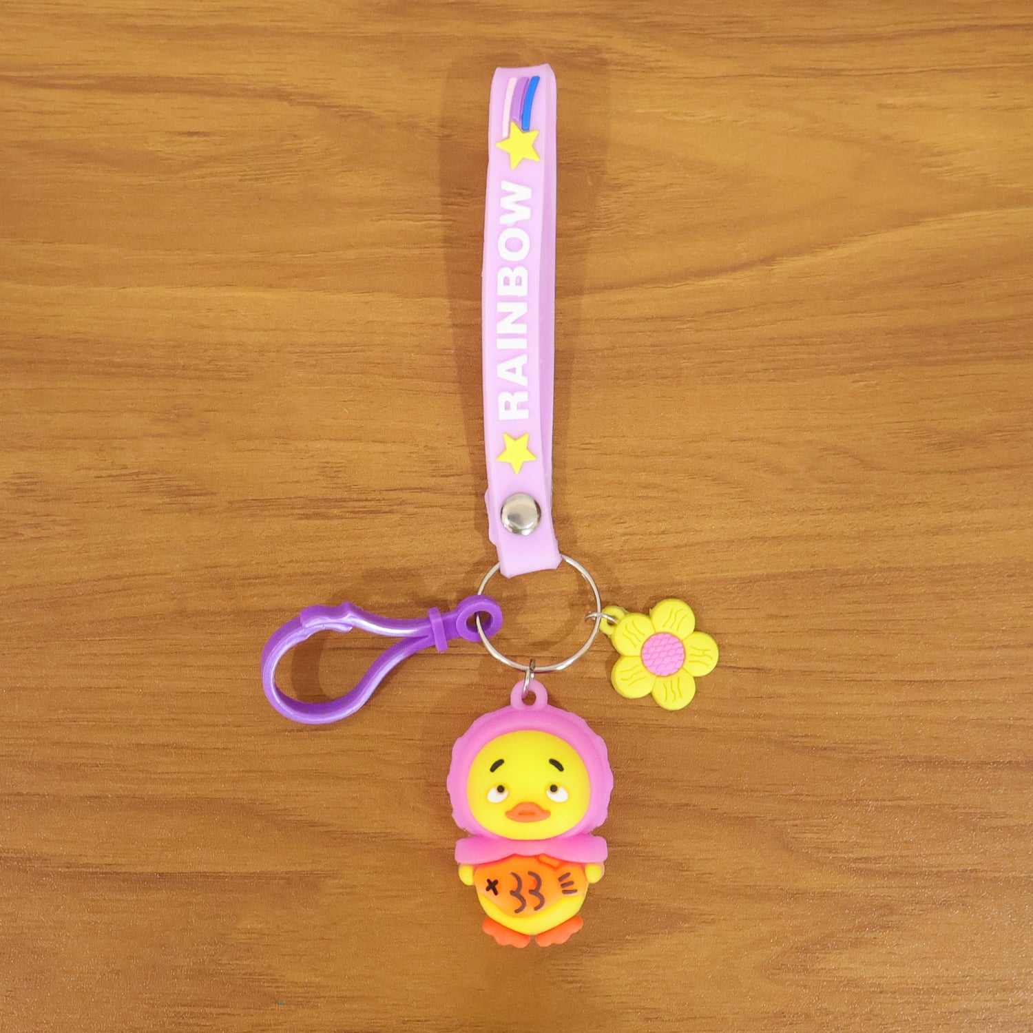 Back view of the rainbow duck keychain highlighting the colorful silicone strap