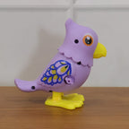 Playing with colorful wind-up bird toy for kids