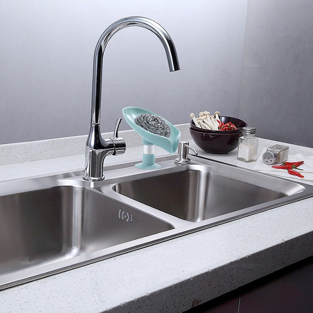 Self-draining leaf-shaped plastic soap holder in a clean bathroom setting.