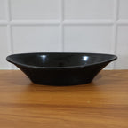 Deep black plastic serving bowl perfect for salads and snacks