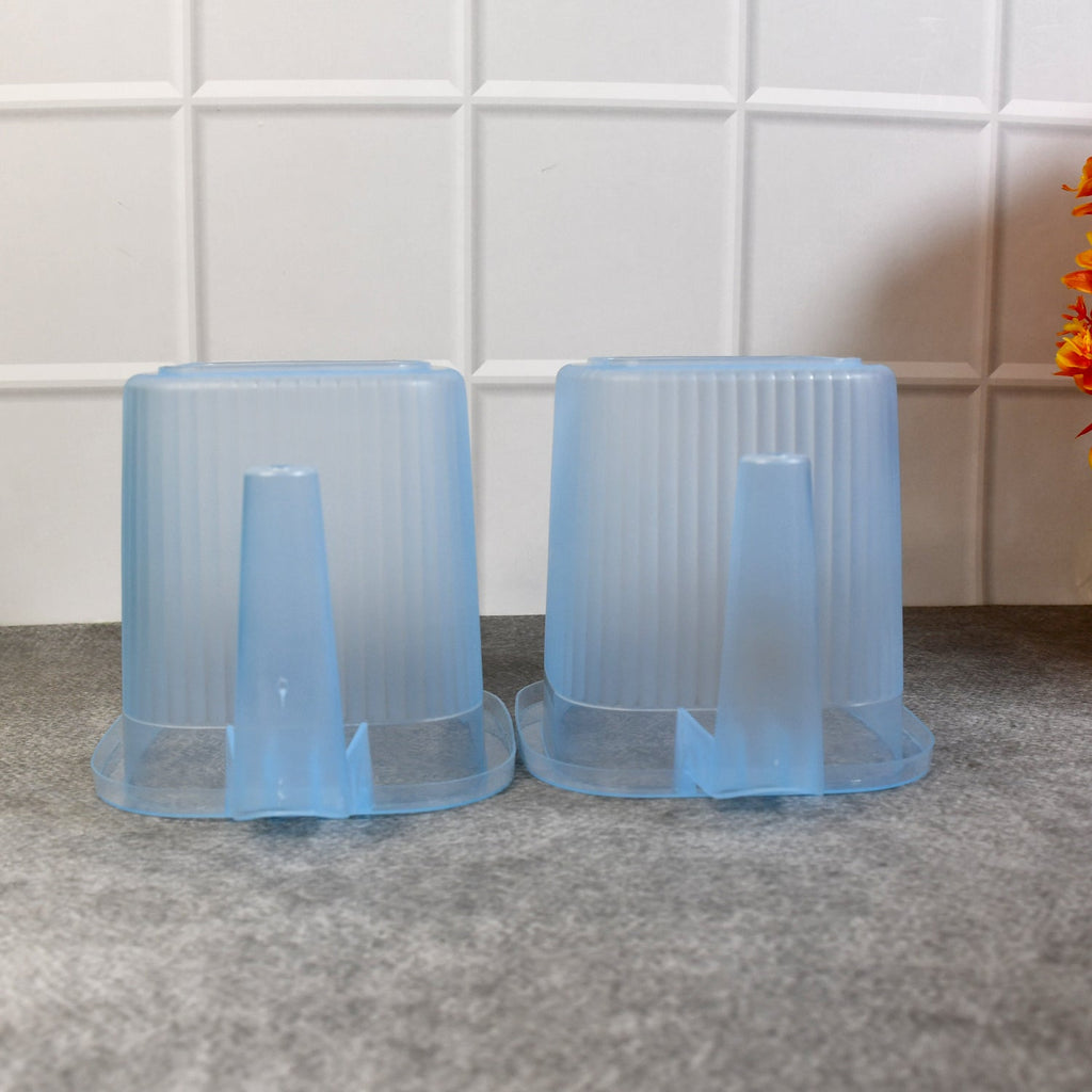 Four vibrant 1000 ML plastic bath mugs arranged neatly, ready for everyday home use.