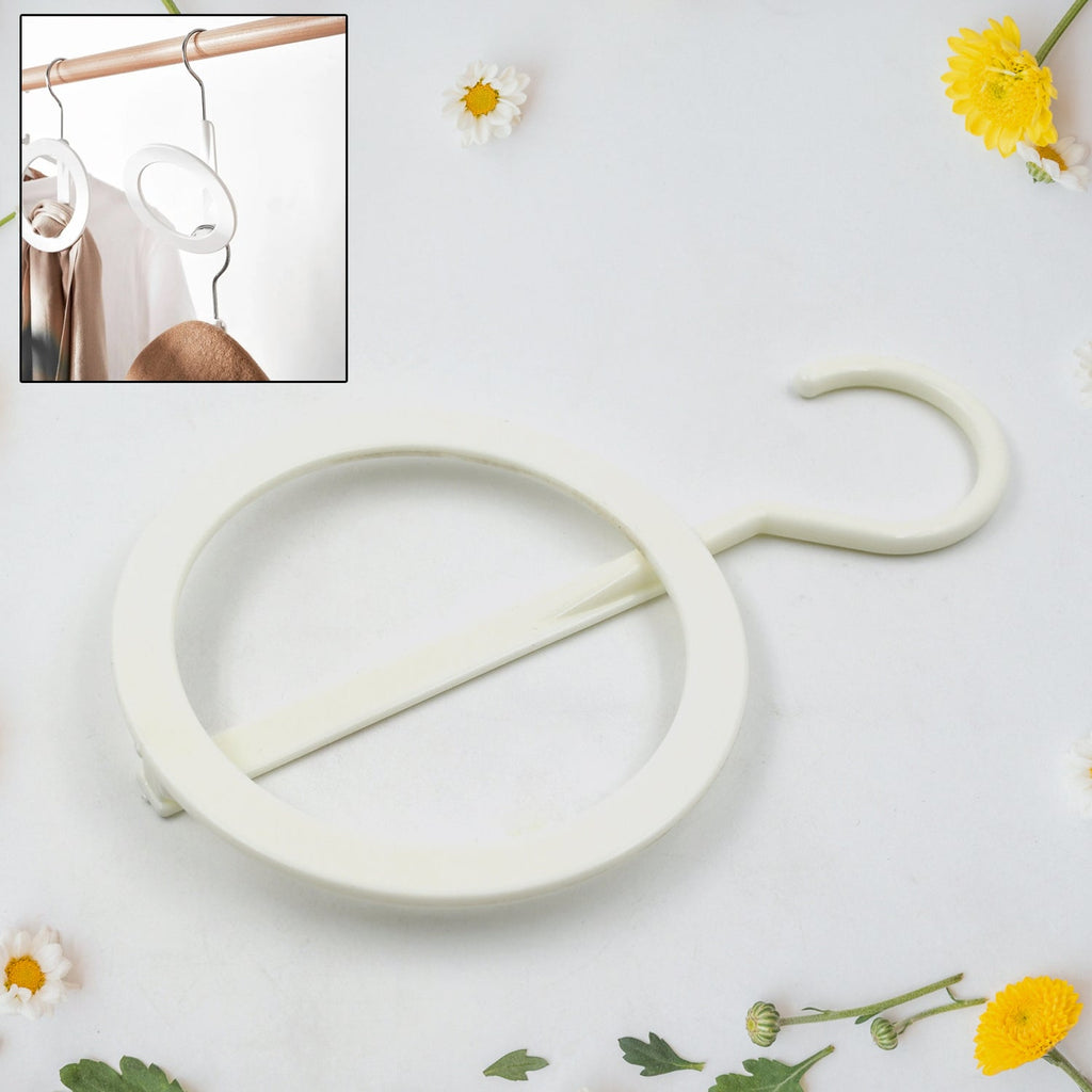 Versatile circular Closet Organizer Hanger displaying various items like towels and handbags.