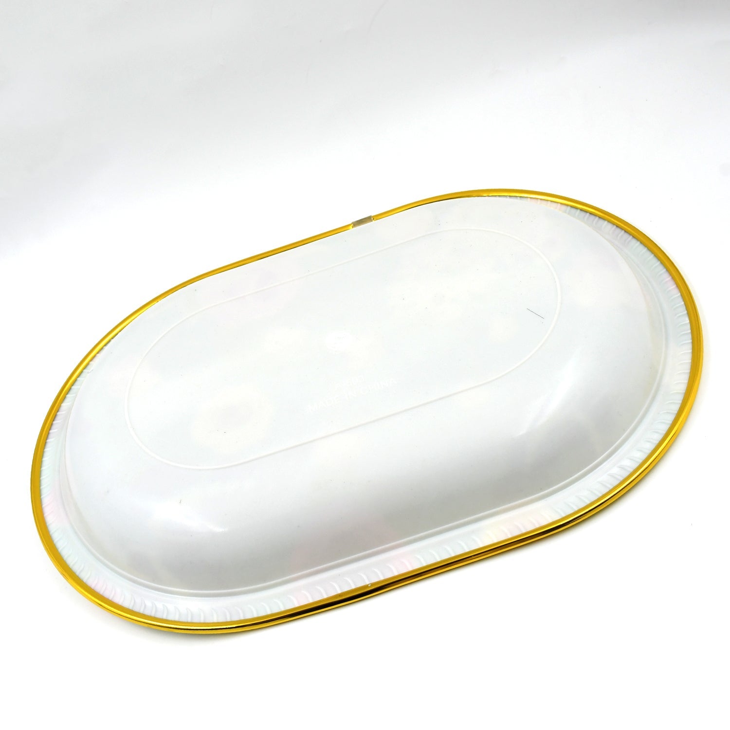 Multiple plastic serving trays stacked, highlighting their compact storage.