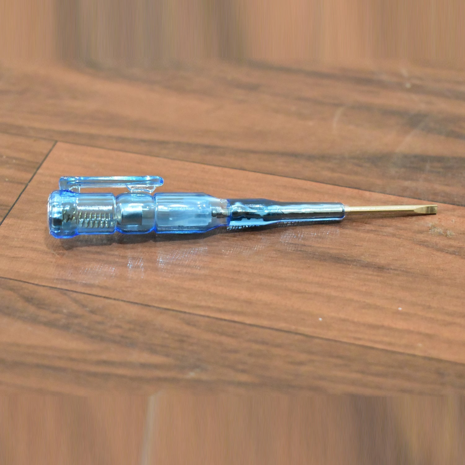 Linemen's screwdriver featuring a metal tester, crucial for electrical repairs.