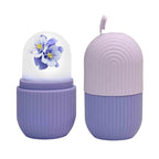 GlowForm purple ice roller placed on a textured surface, ready for use.