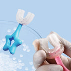 Detailed view of the easy-grip star handle on the Kids U-Shape Toothbrush, promoting independent brushing.