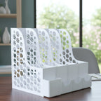 Desk organizer on an office desk improving file and stationery storage.