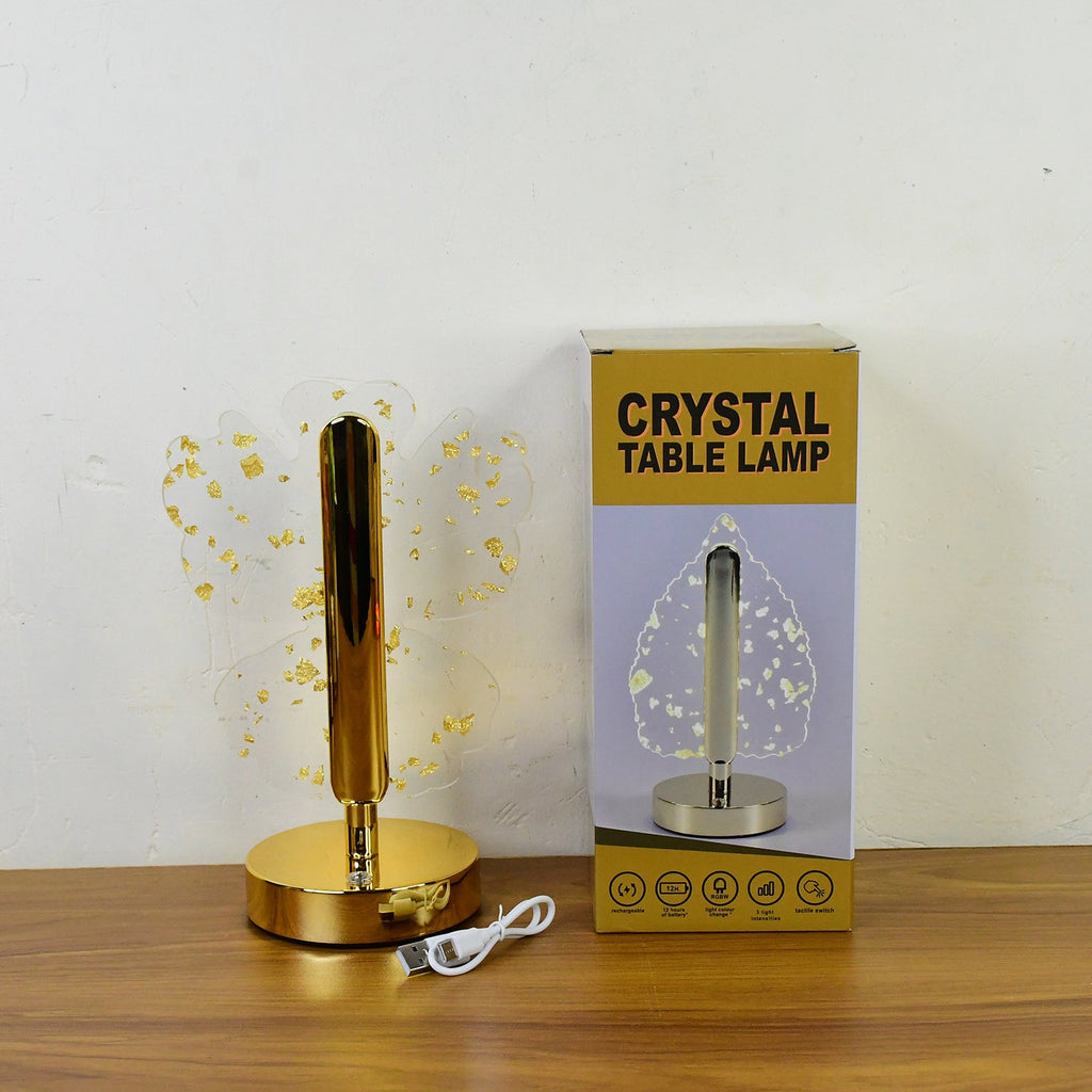 Luxury golden crystal LED table lamp illuminated in ambient setting