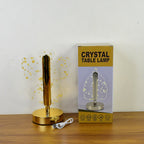 Luxury golden crystal LED table lamp illuminated in ambient setting