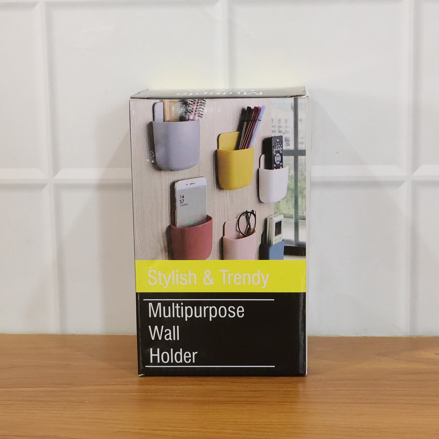Set of four multi-colour plastic wall holders mounted on a sleek stainless steel surface.
