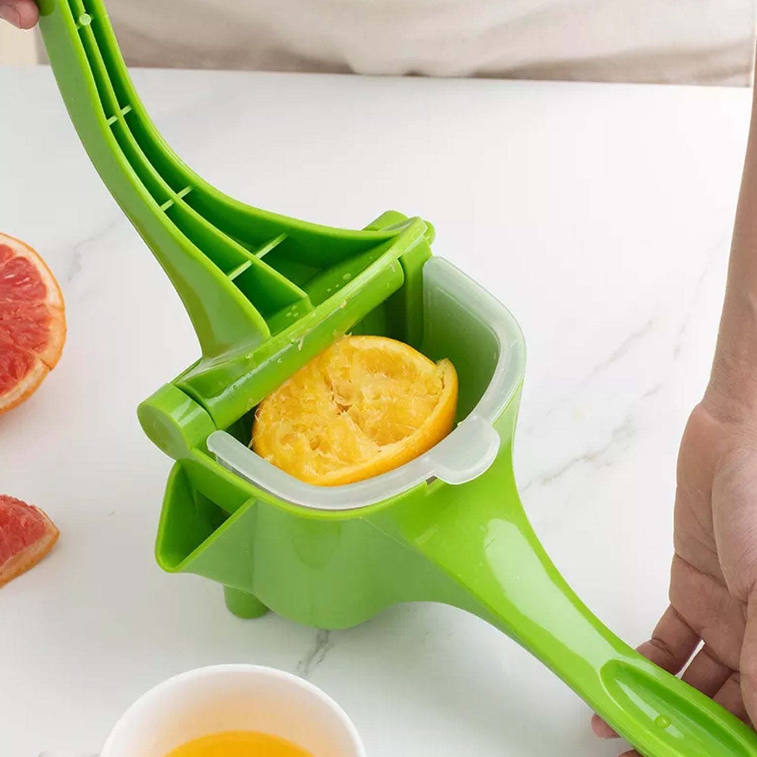 Manual juicer disassembled for easy cleaning and maintenance.