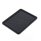 Universal anti-skid mat preventing items from sliding on a smooth table surface.