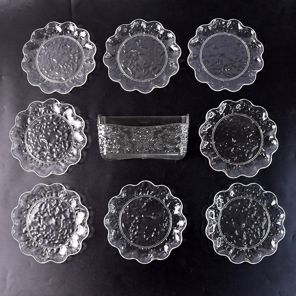 9-piece plastic bowl set with serving tray displaying transparent bowls and plates
