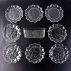 9-piece plastic bowl set with serving tray displaying transparent bowls and plates