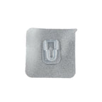 GlimmerHome transparent adhesive hook discreetly blending into a white wall.